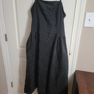 Womans black calf lengh dress with pockets cut out back  size 14